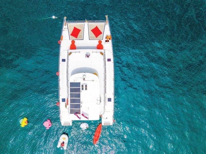 Amazing Coral Island & Sunset Dinner with Power Catamaran - Coral Island: beach time with a practical catch