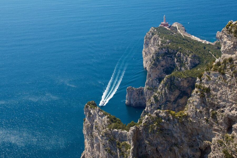 Capri: Guided Island Boat Tour With a Stop at the Caves - Passing the Faraglioni rocks