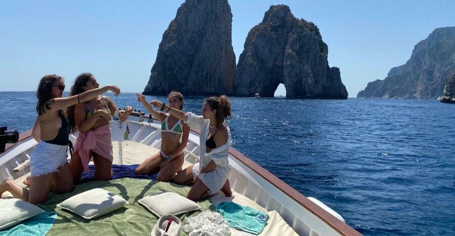 Capri: Island and Grottos Boat Cruise with Snacks and Drinks - Grottos, arches, and the first stretch of coast