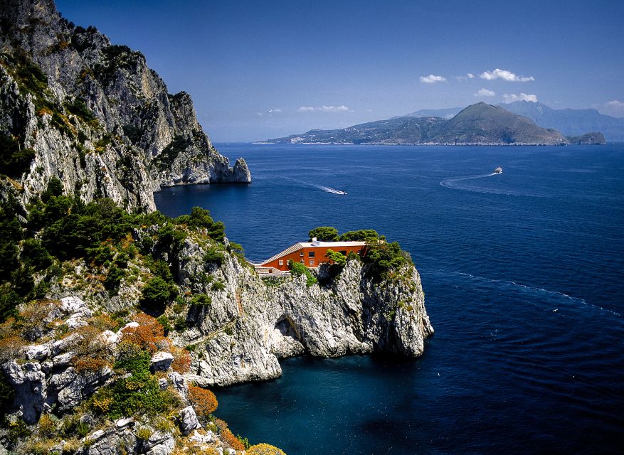Capri: Island Boat Tour with Blue Grotto Stop - Arco Naturale frames the cliffs
