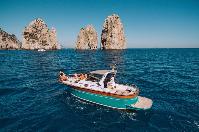 Capri Island Small Group Boat Tour from Naples with Light Lunch - The boat circuit: grottos, arches, and Faraglioni