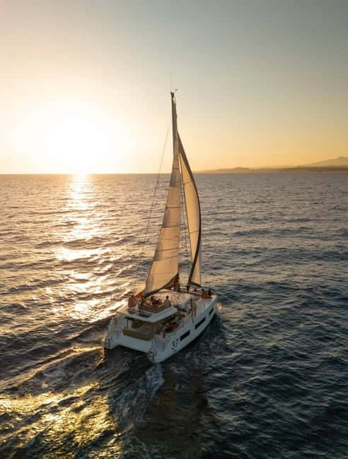 Catamaran trip to the Lavezzi Islands at sunset with snorkeling - Learning to sail on the way to the islands