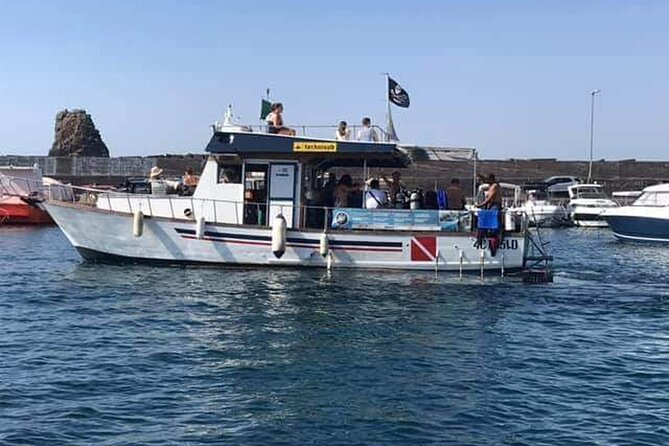 Catania: Cyclops Islands & Timpa Nature Reserve Boat Tour - Leaving Aci Castello on a 13-meter boat