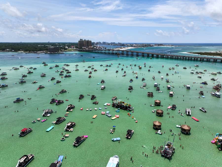 Destin: Tiki Pub Crab Island Sandbar Cruise with Waterslide - A floating tiki bar with a built-in waterslide