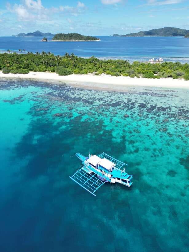 El Nido to Coron: 3-Day 2-Night Island-Hopping Expedition - The second night: simple comforts and a shared table