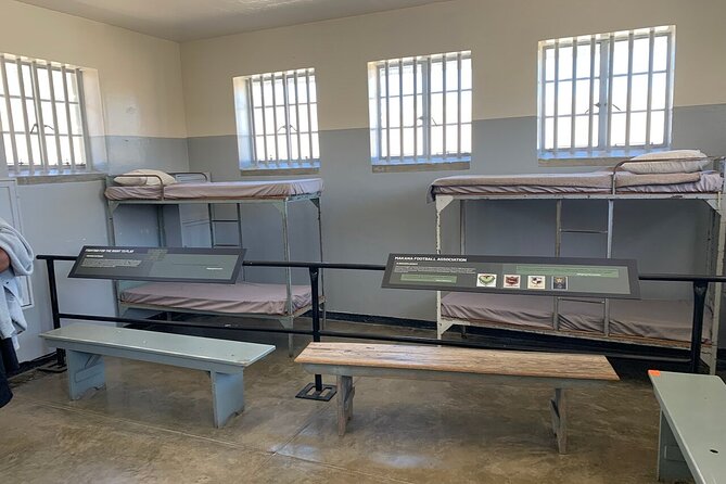 Ferry Tour to Robben Island Museum with One Way Hotel Transfer - Standing outside Nelson Mandela’s cell