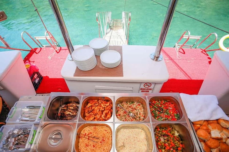 Fethiye: 12 Islands Boat Tour with Lunch and Hotel Transfer - Lunch with fish, chicken, and Turkish side dishes