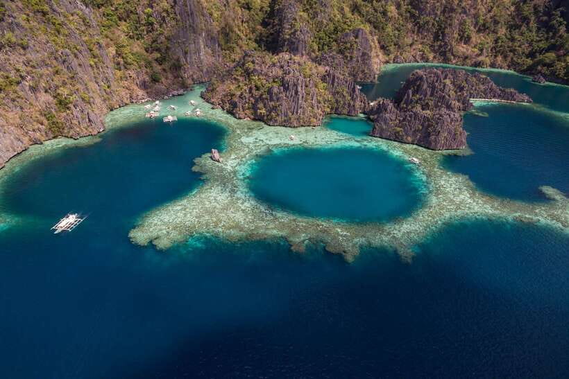 From Coron: Island Hopping Boat Day Trip with Buffet Lunch - Kayangan Lake, the day’s headline swim