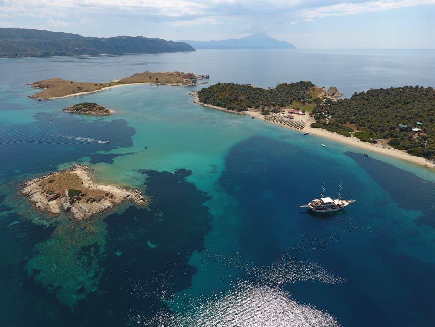 From Ouranoupoli: Blue Lagoon Two Island Cruise - Ammouliani Island, local products, and older village buildings