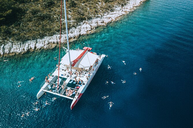 Full-Day Catamaran Cruise to Hvar & Pakleni Islands with Food and free Drinks - The Open Bar and Sunset Ride Home