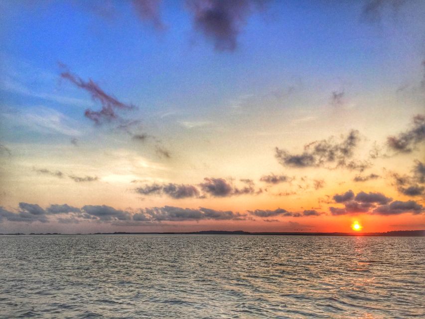 Hilton Head Island: Sunset Creek Cat Boat Tour - Racing past Harbour Town Lighthouse