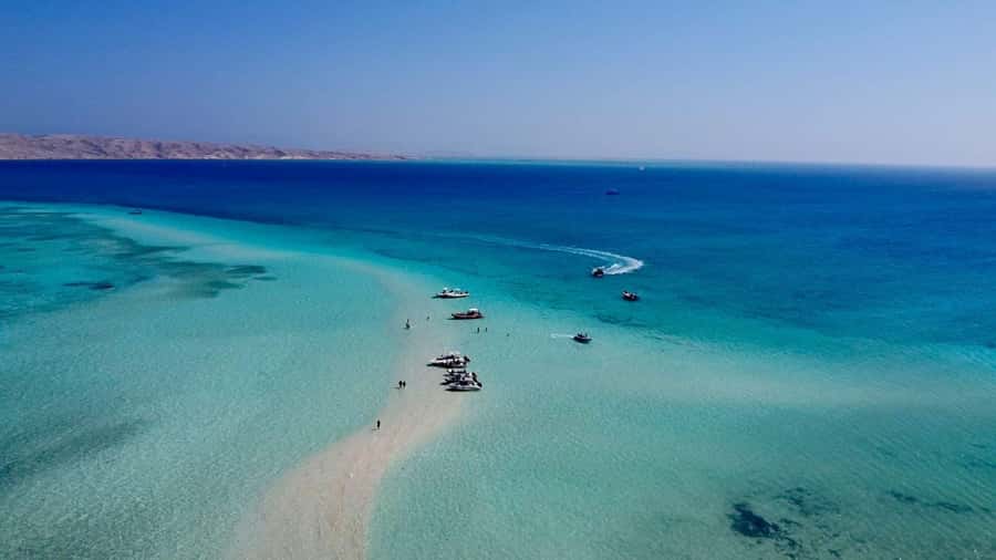 Hurghada: Elegance Yacht Cruise To Orange & Magawish island - Parasailing above the Red Sea