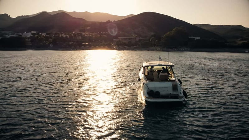 Kos: Seanomad Private Luxury Yacht Full Day 2 Islands Cruise - Vathi Beach on Pserimos: cliffs, calm water, and a quiet start
