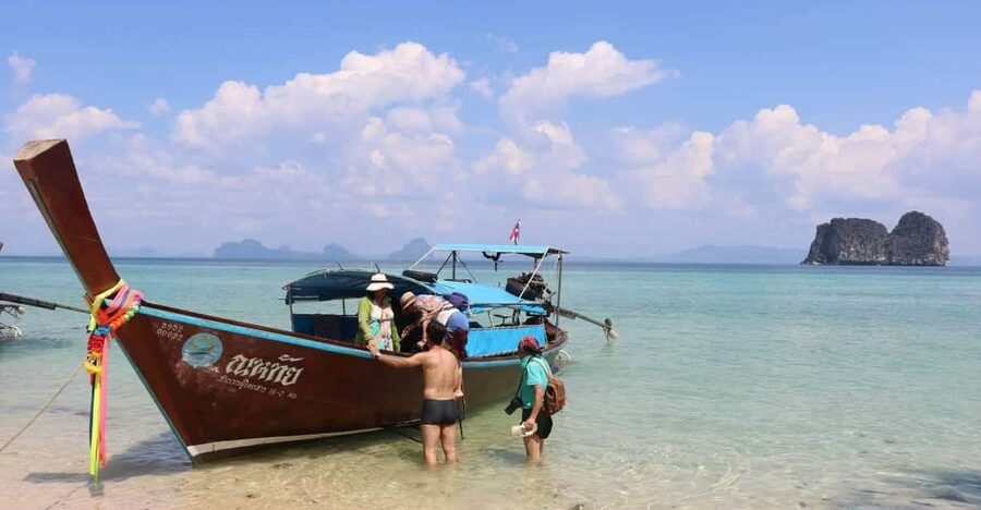 Lanta's Hidden Gems: 4 Islands by Traditional Longtail Boat - Leaving Lanta Old Town by longtail boat