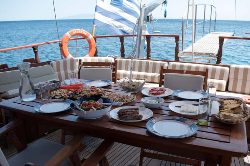 Mykonos: Delos and Rhenia Islands Cruise with BBQ Meal - The crew and atmosphere on a shared boat