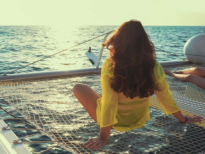Mykonos: Rhenia Island Catamaran Cruise with Meal and Drinks - The crew, music, and overall mood