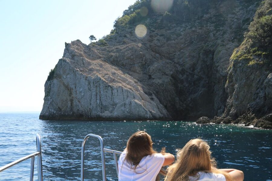 Opatija/Lovran: Boat Trip to Secluded Beaches on Island Cres - Brseč Beach beneath the cliffs