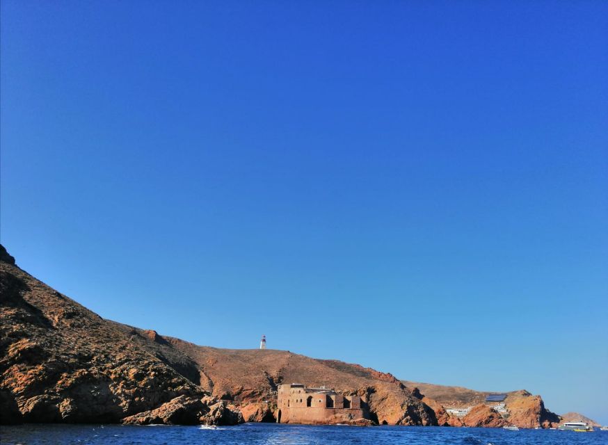 Peniche: Berlengas Island Round-Trip Ferry with Island Stop - The harbor, cliffs, and Elephant Rock