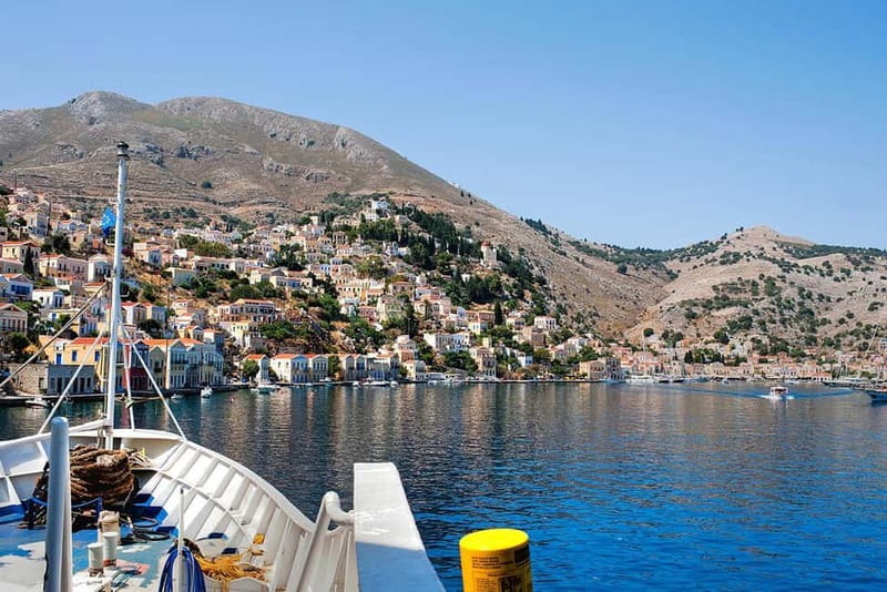 Rhodes: Boat trip to Symi island with swimming at St. George - Arriving in Symi through the natural harbor