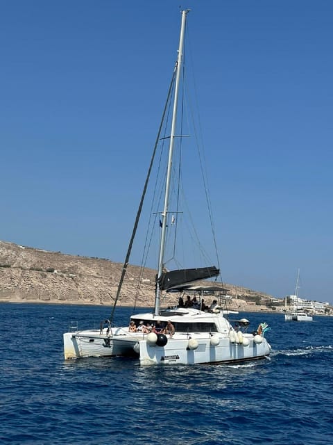 Santorini:Cruises with Catamaran around the Volcanic Island. - What the crew and transport add