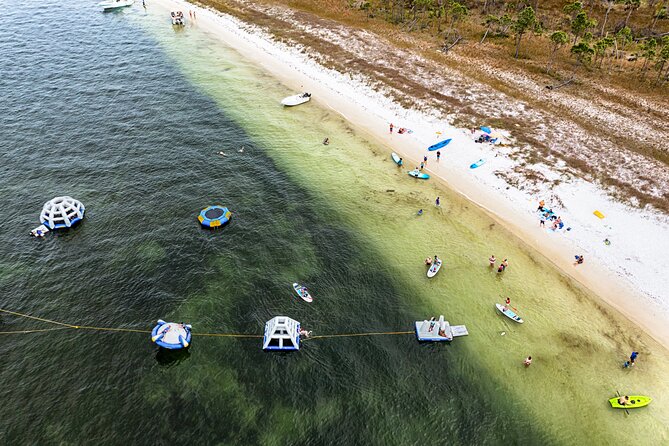 Shell Island Inflatable Adventure Park & Dolphin Sightseeing Tour - Kayaks, paddleboards, and snorkeling for a slower pace