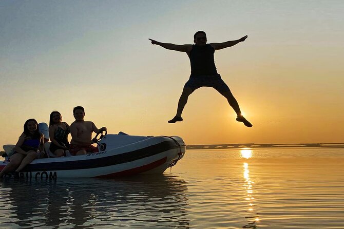 Small-Group Self-Drive Speedboat Tour in Yas Island Mangroves - Flamingos, golf greens, and a Ferrari World backdrop