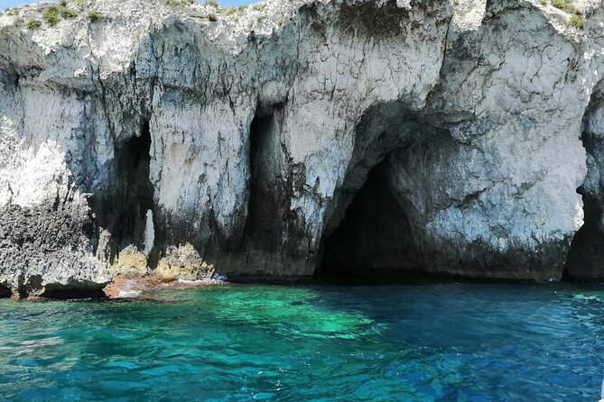 Syracuse Boat Excursion with Snorkeling to the Sea Caves - Swimming beneath the castle