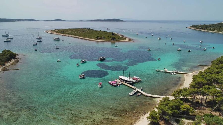 Trogir: Blue Lagoon and 3 Islands Speedboat Tour - Blue Lagoon: clear water, sharp stones, and summer crowds