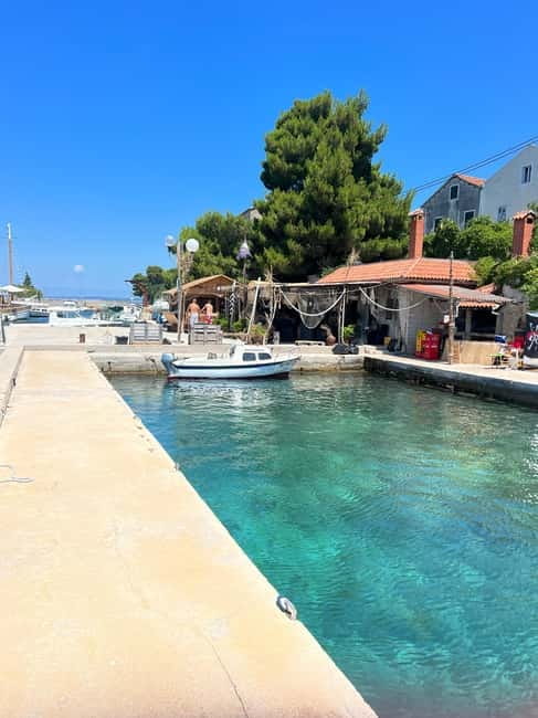 Zadar: 3 Island Speedboat Tour & Blue Bay Swim with Drinks - What the boat day feels like in changing weather