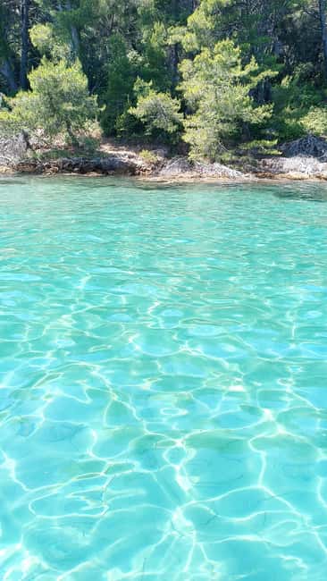 Zadar: Three Islands Private Boat Tour - A small boat and a local view of Zadar